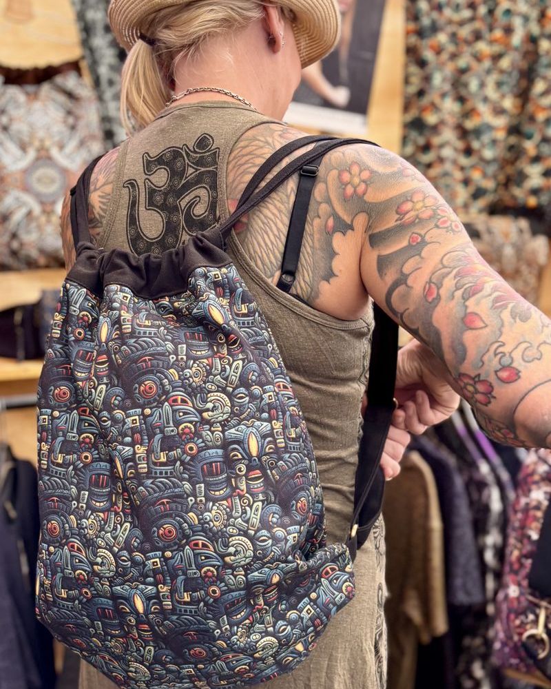 Festival goer at Ozora carrying a SOL printed backpack