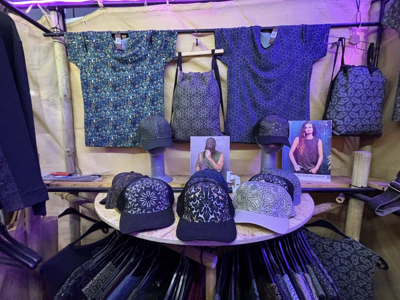 Psychedelic print caps on display at the SOL festival booth