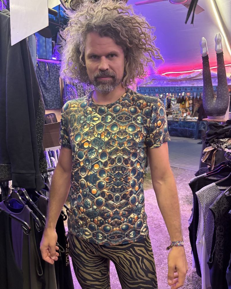 Festival goer at Ozora wearing a SOL psychedelic cotton t-shirt
