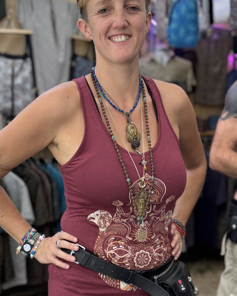 Woman at Ozora festival in a SOL dress with a printed pocket belt