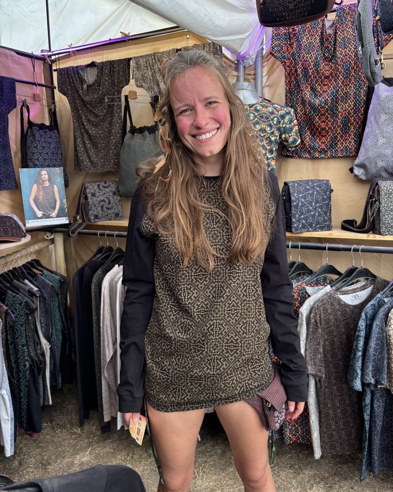 Woman at Ozora festival wearing a SOL printed long sleeve top